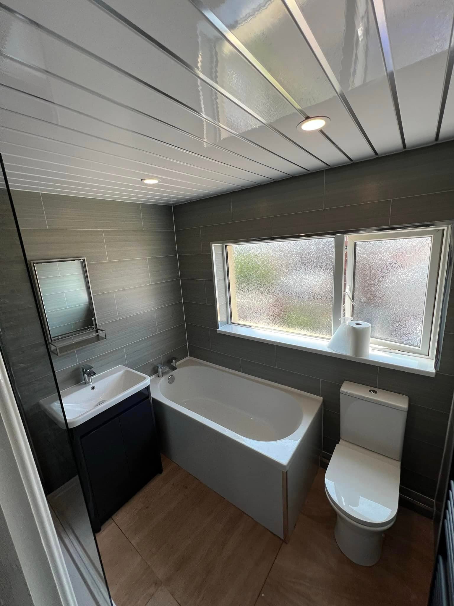 Bathroom refit, dark tile and navy vanity