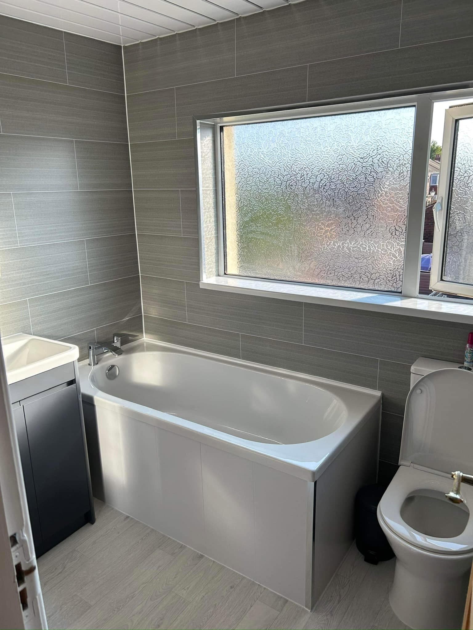 Bathroom refit with panelled bath and chrome brassware